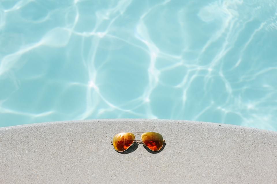 Clear pool water at the edge of a pool deck